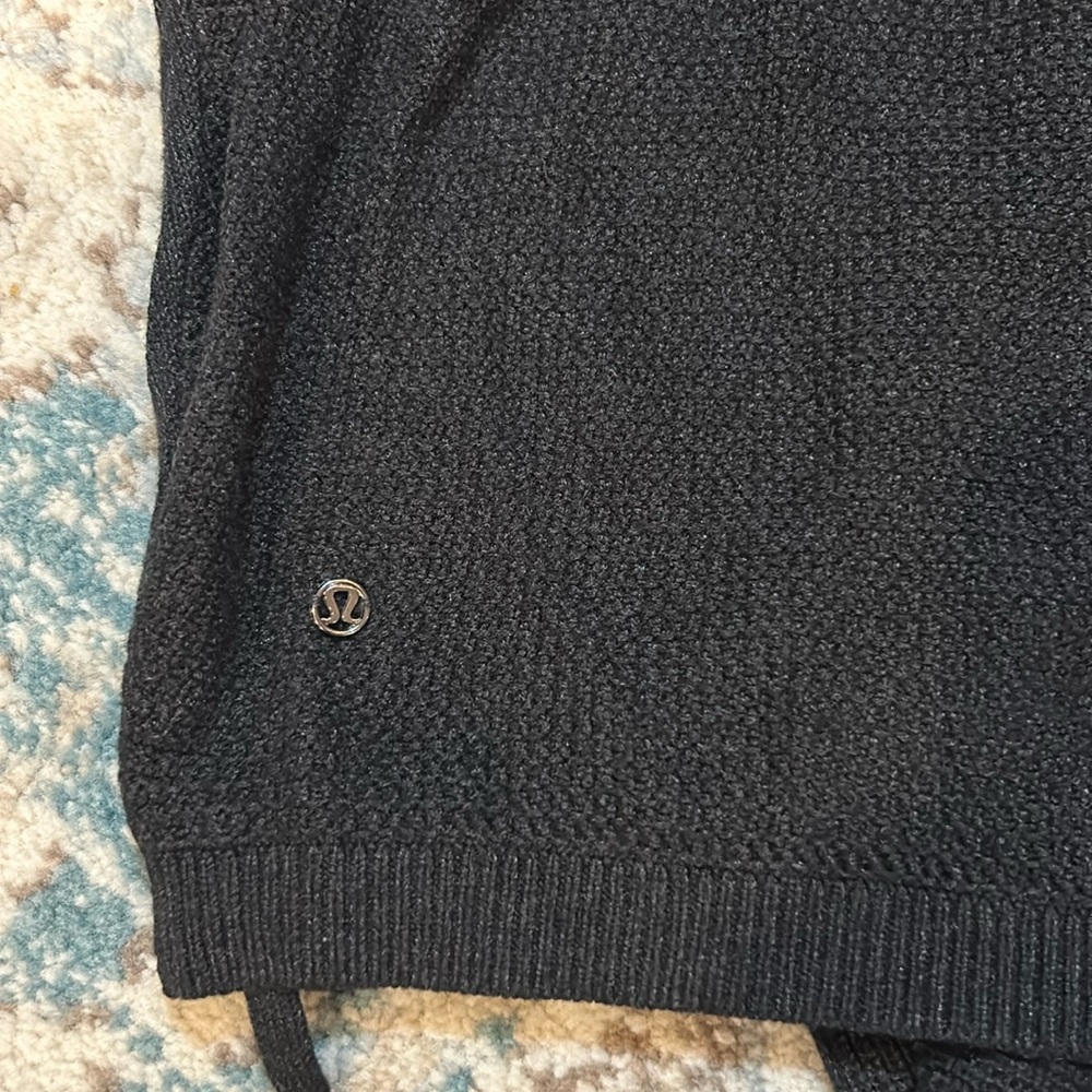 Black Lululemon short sleeved sweater, size 6.